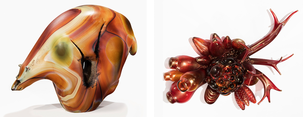 a glass sclupture resembling a bear carved from wood, and a glass sculpture resembling a crab