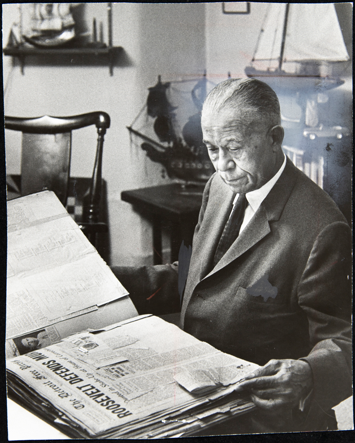 John C. Dancy, Executive Director of the Detroit Urban League, Looking through a Scrapbook, May 1966