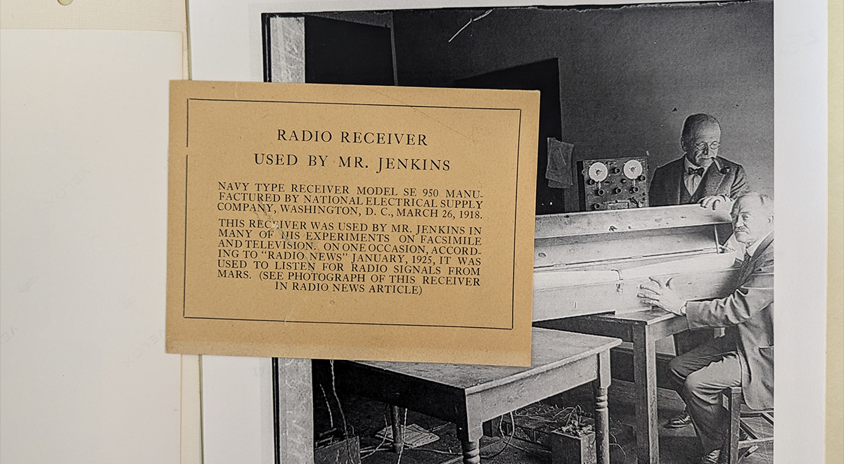 Label from a former exhibit at The Henry Ford with details about Jenkins’ SE-950 radio. The radio is visible in the image above, to the left of Todd (standing). Jenkins is seated with another component of the Jenkins Radio Camera