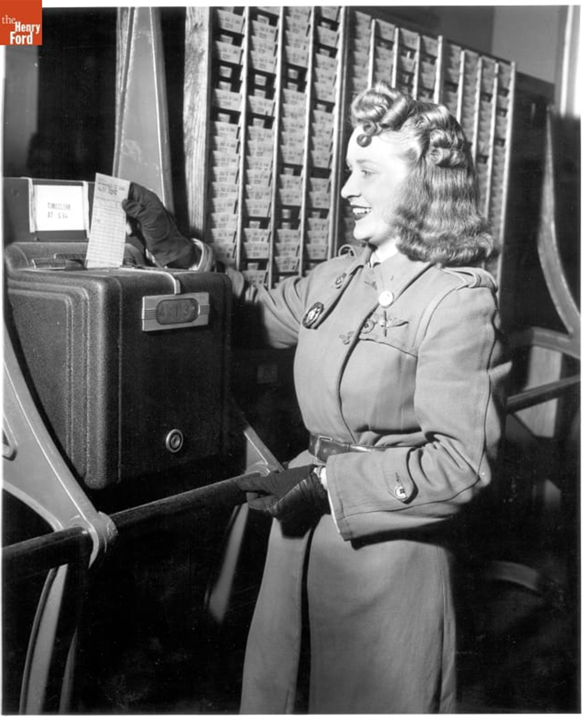 Norma Denton Using the Time Clock at Willow Run Bomber Plant, 1943