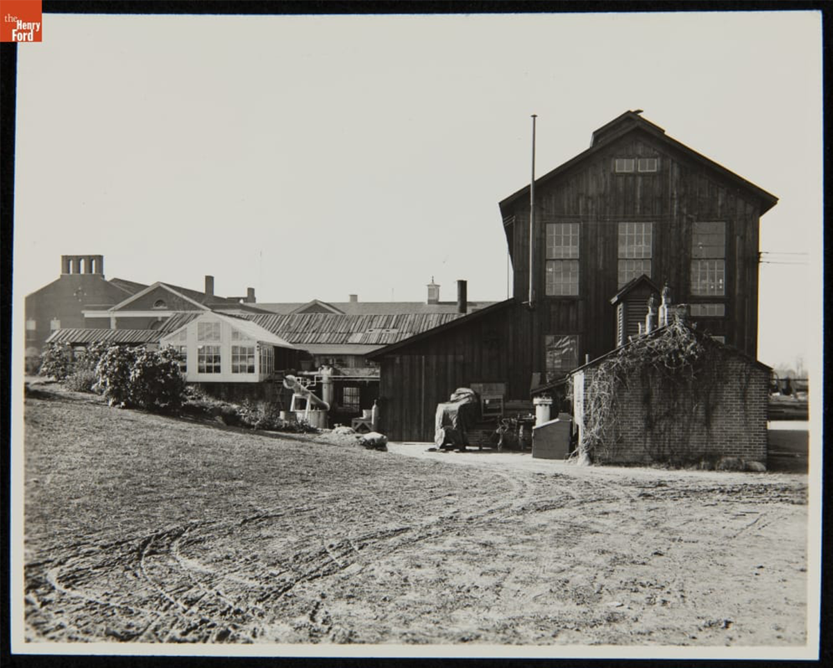 Chemical laboratory in Greenfield Village with Lovett Hall, The Edison Institute, visible in the background, 1930. This image predates Henry Ford instructing the chemists to focus on soybeans 