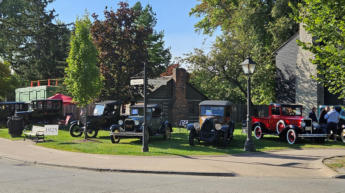 The corner of Maple and Post hosted a Ford Model T pickup and Model A roadster alongside a 1925 Franklin sedan and a 1931 Chevrolet pickup